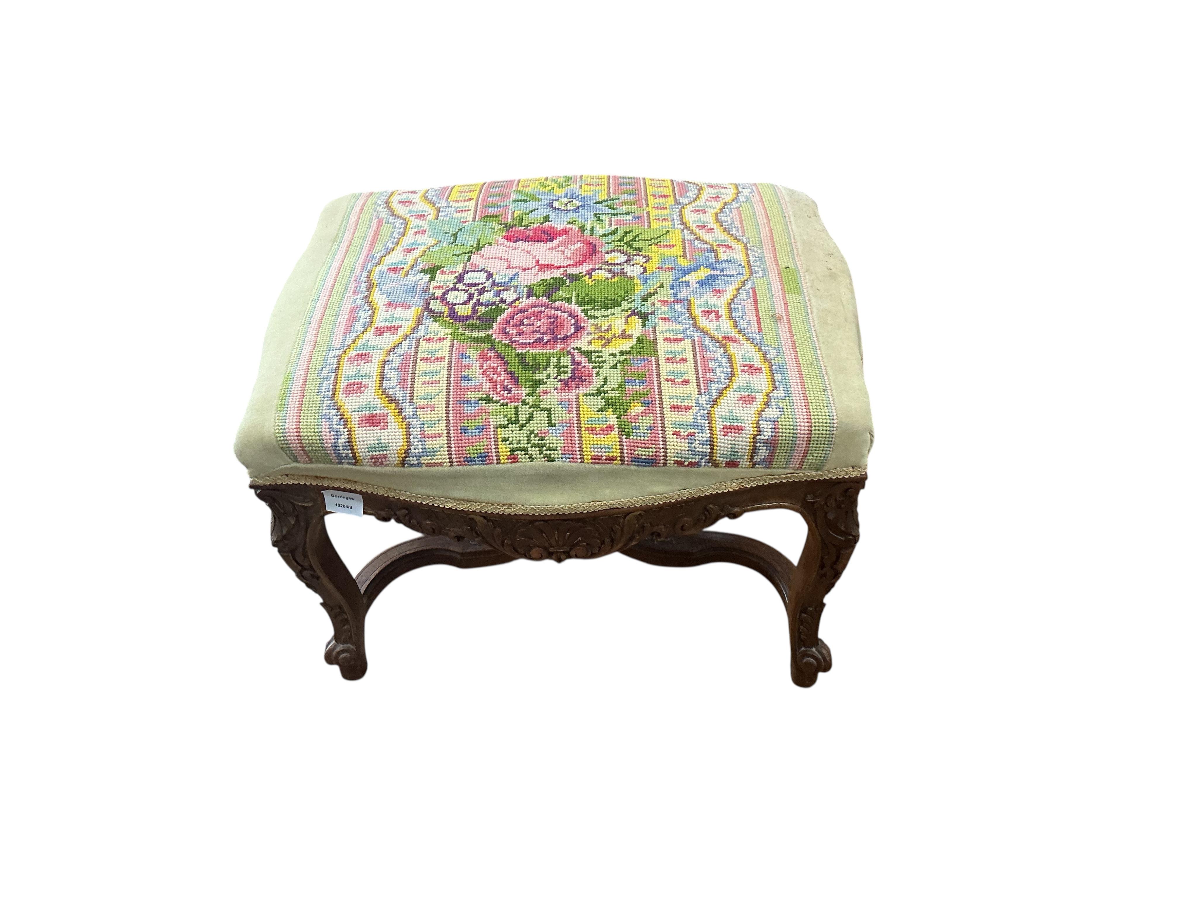 A 19th century French carved walnut dressing stool, with a tapestry upholstered top, width 62cm, depth 48cm, height 44cm